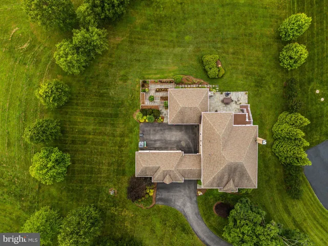 a kitchen with stainless steel appliances granite countertop a refrigerator a sink and a stove