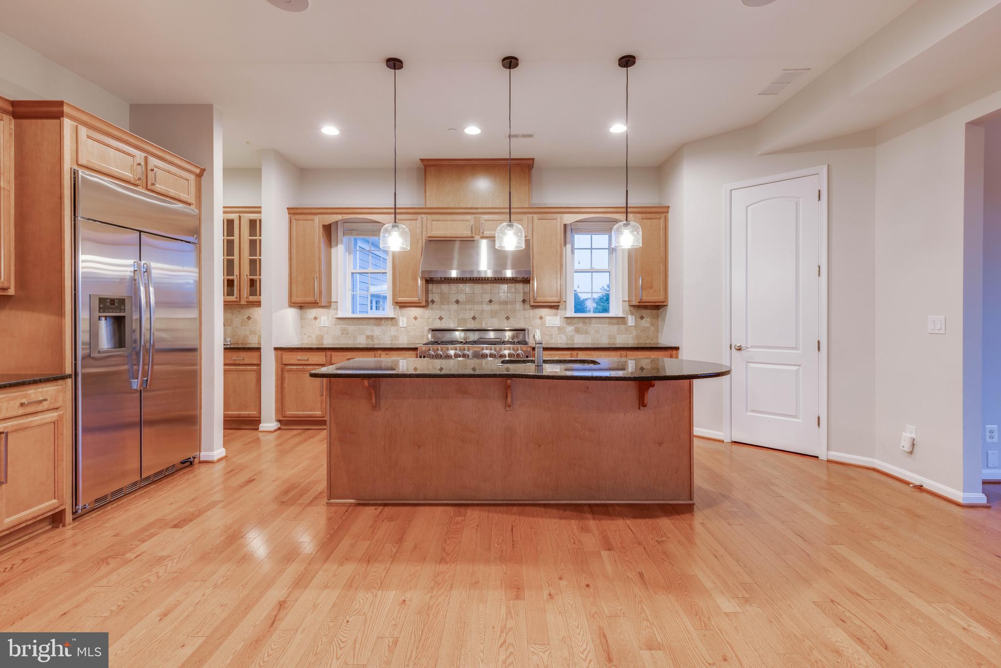 3913 Briar Knoll Circle Phoenix, MD 21131 - Photo 17 of 39 a kitchen with stainless steel appliances granite countertop a refrigerator a sink and a stove