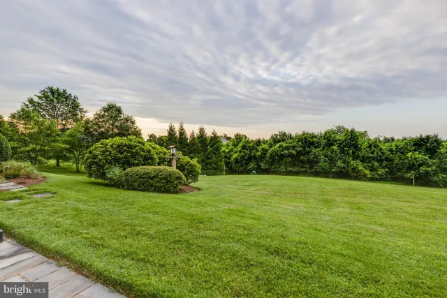 a view of a house with a yard from a window