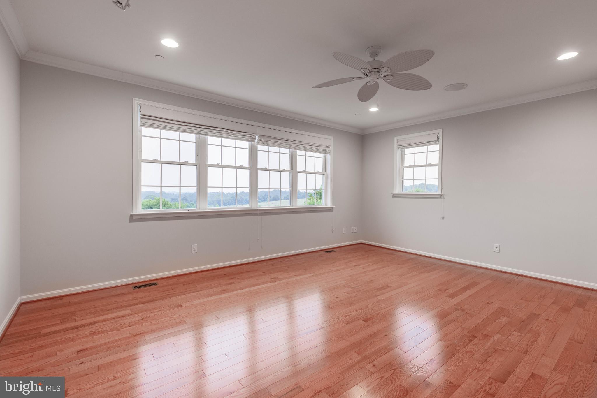 3913 Briar Knoll Circle Phoenix, MD 21131 - Photo 26 of 39 wooden floor in an empty room with a window