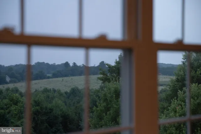 a front view of a house with a yard table and chairs
