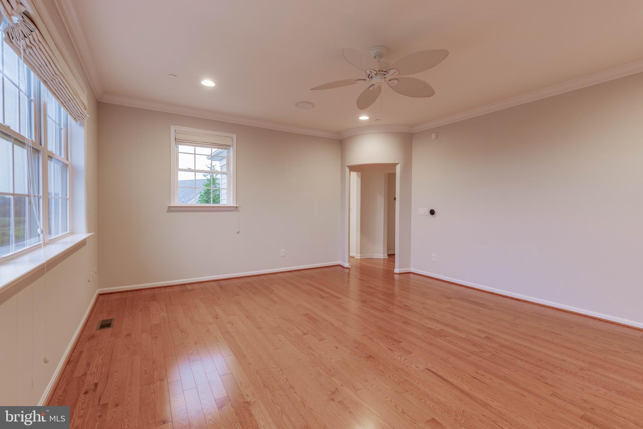 3913 Briar Knoll Circle Phoenix, MD 21131 - Photo 28 of 39 a view of an empty room with wooden floor and a window