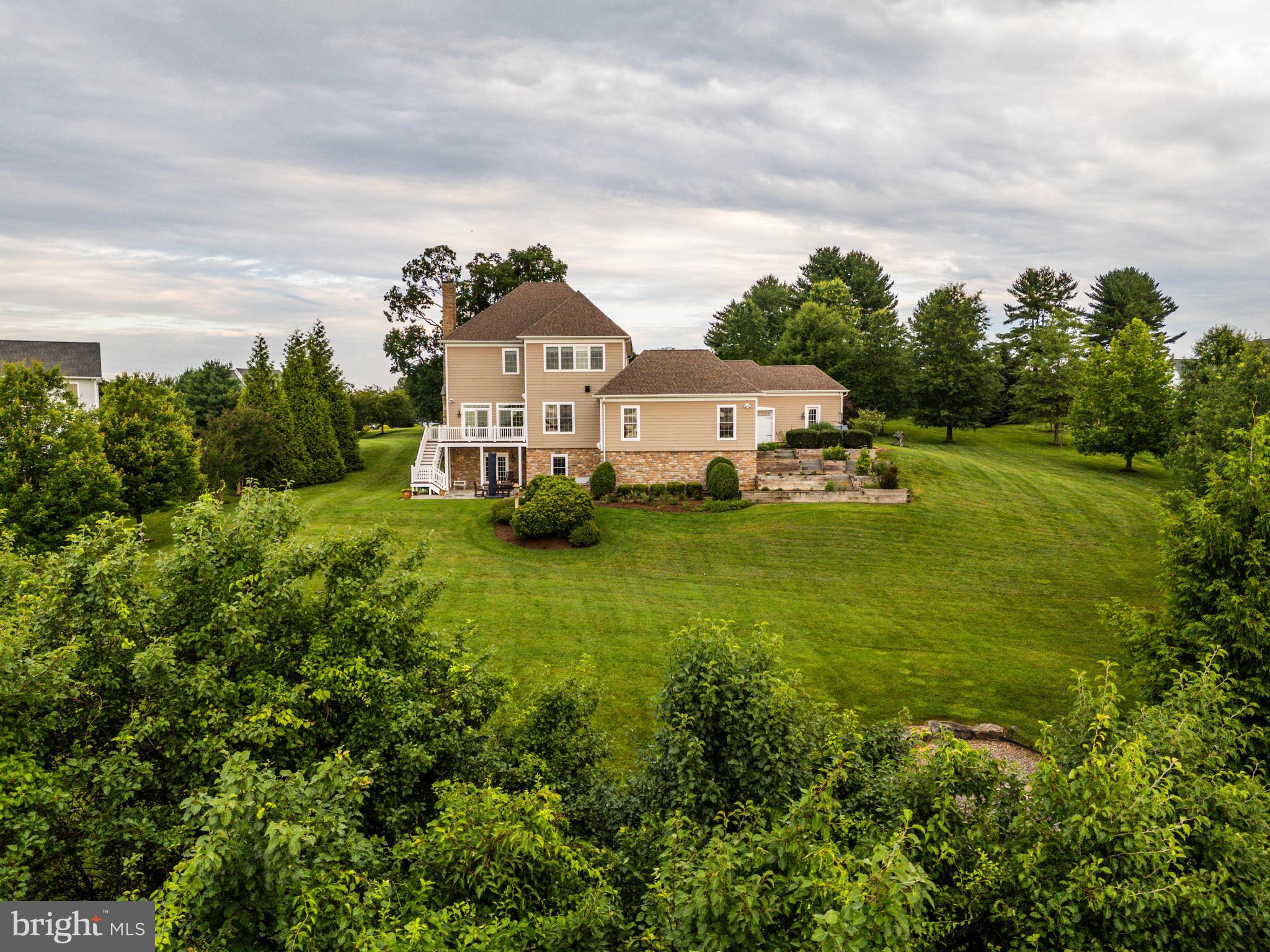 3913 Briar Knoll Circle Phoenix, MD 21131 - Photo 30 of 39 a front view of a house with a yard table and chairs