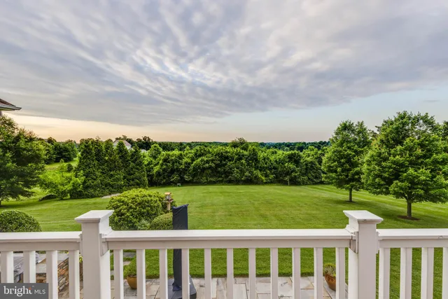 a view of a garden with an outdoor seating