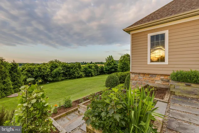 a kitchen with granite countertop a sink and cabinets