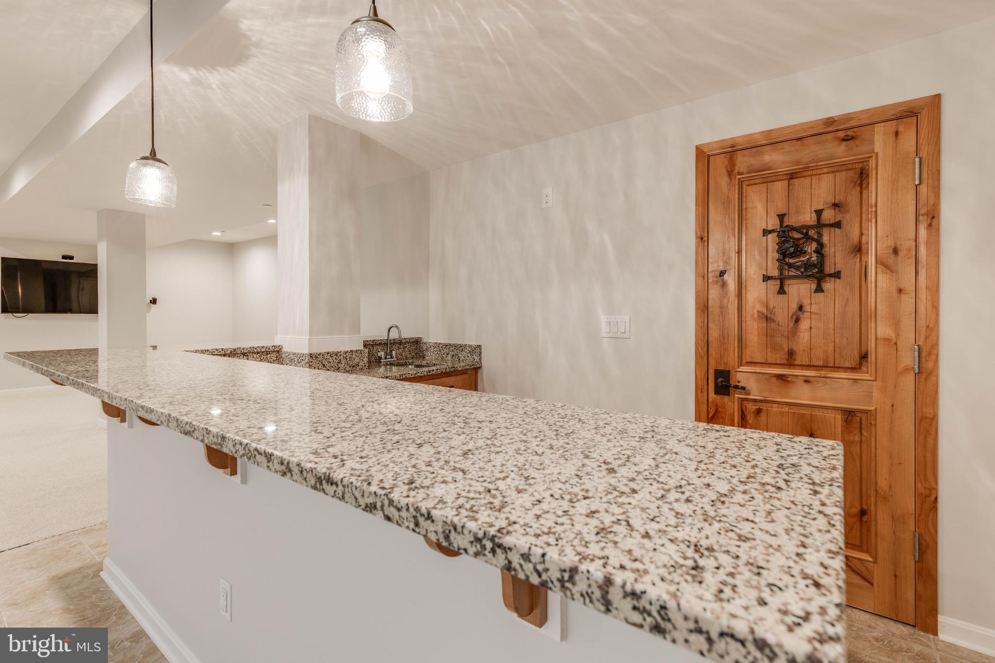 3913 Briar Knoll Circle Phoenix, MD 21131 - Photo 33 of 39 a bathroom with a granite countertop sink a toilet and a shower