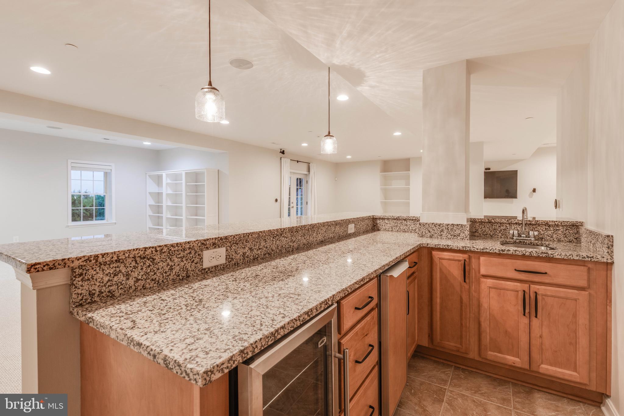 3913 Briar Knoll Circle Phoenix, MD 21131 - Photo 34 of 39 a kitchen with granite countertop a sink and cabinets