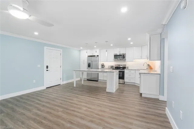 a view of kitchen with wooden floor