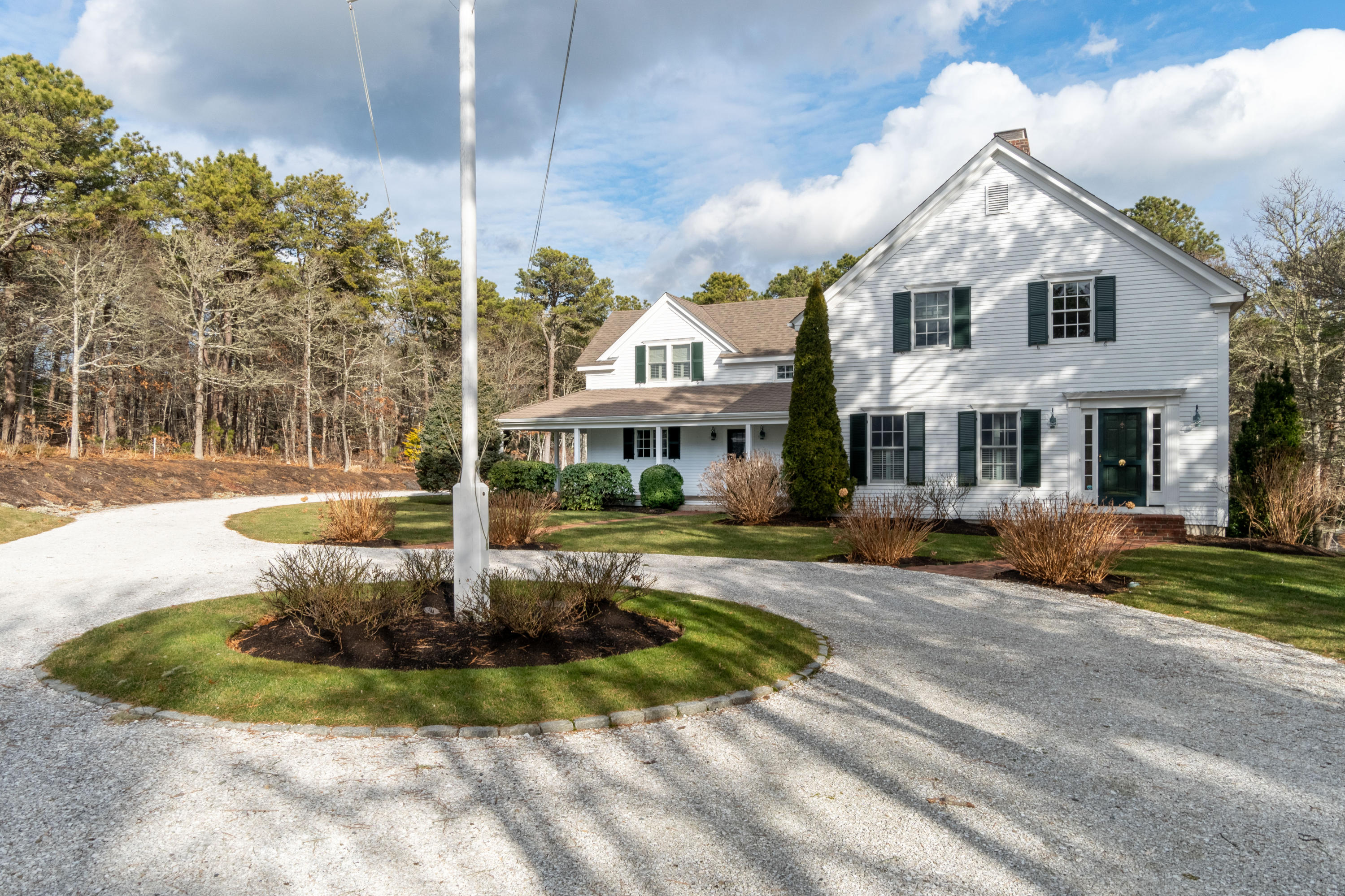 150 Training Field Road Chatham, MA 02633 - Photo 3 of 42 a front view of a house with a yard fountain