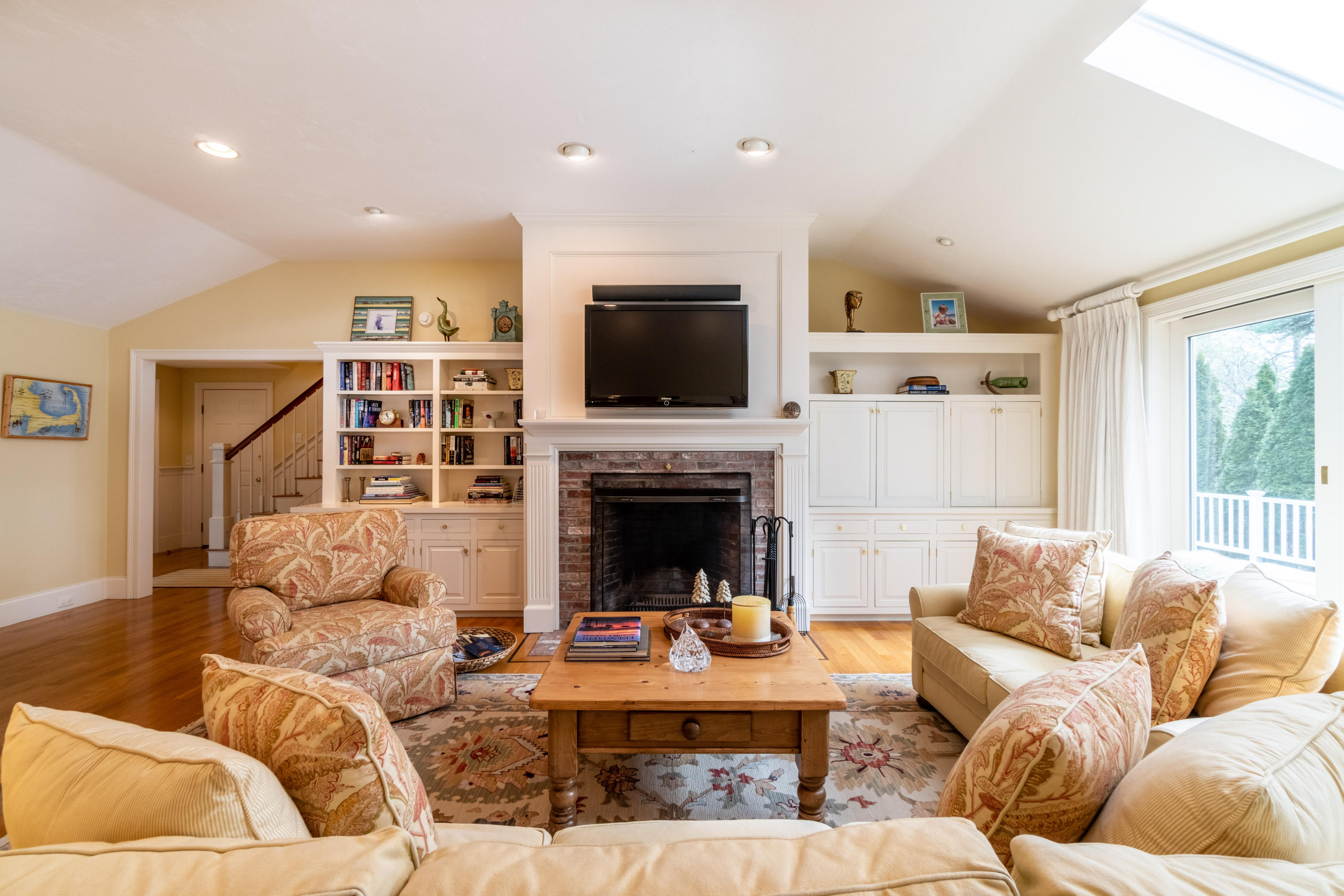 150 Training Field Road Chatham, MA 02633 - Photo 31 of 42 a living room with furniture fireplace and flat screen tv