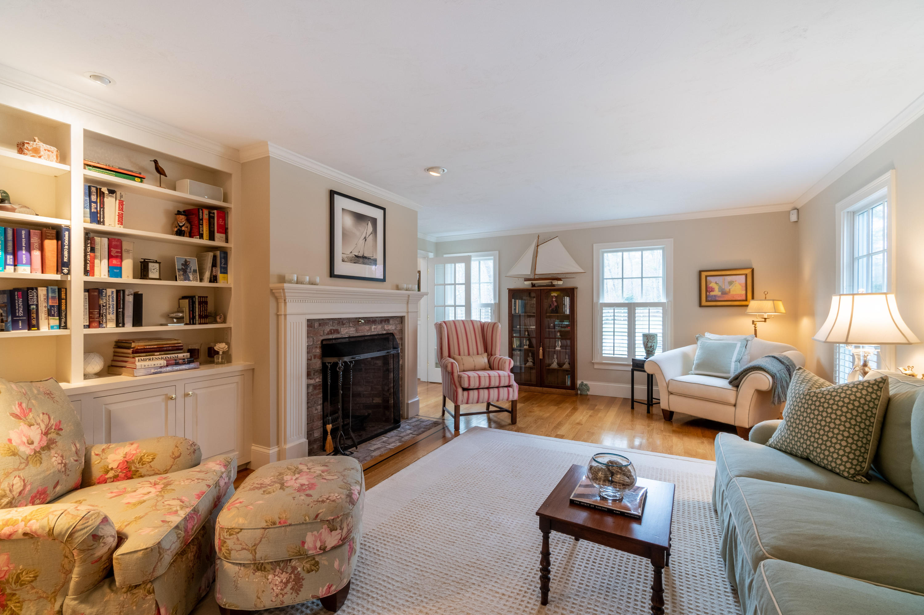 150 Training Field Road Chatham, MA 02633 - Photo 8 of 42 a living room with furniture and a fireplace