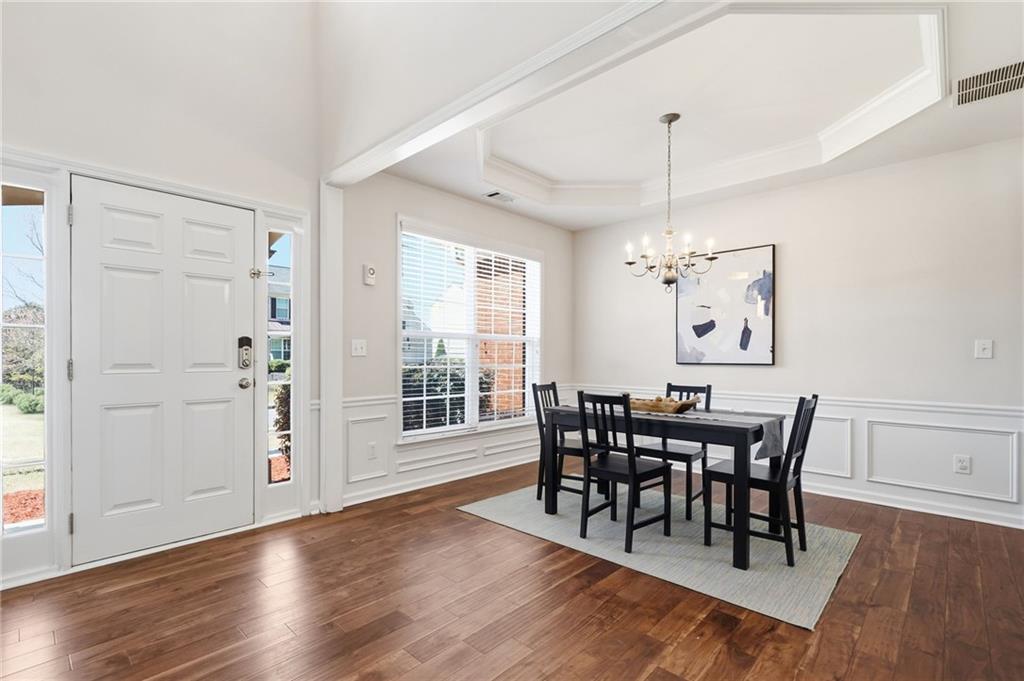 310 Hammersmith Drive Suwanee, GA 30024 - Photo 2 of 55 a view of a dining room with furniture window and wooden floor