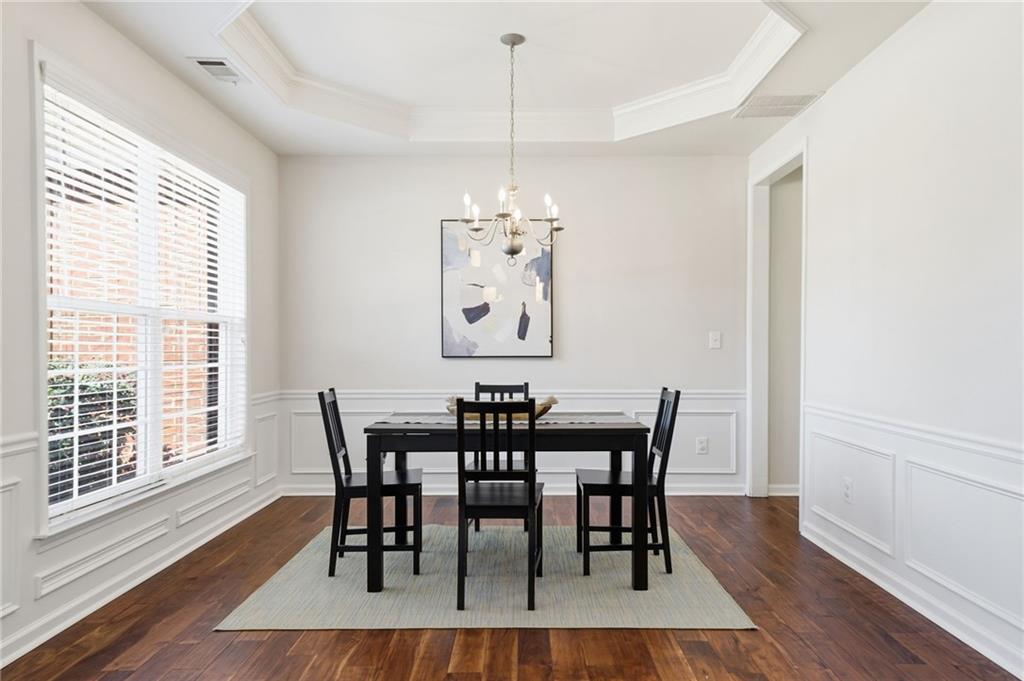310 Hammersmith Drive Suwanee, GA 30024 - Photo 24 of 55 a view of a dining room with furniture window and wooden floor