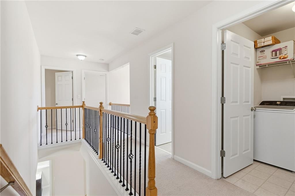 310 Hammersmith Drive Suwanee, GA 30024 - Photo 26 of 55 a view of a hallway with workspace