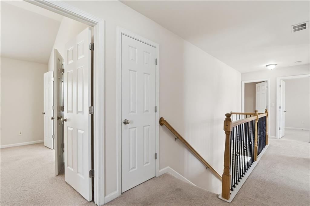 310 Hammersmith Drive Suwanee, GA 30024 - Photo 27 of 55 a view of a hallway with windows