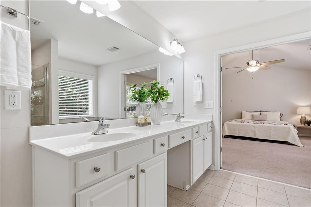 310 Hammersmith Drive Suwanee, GA 30024 - Photo 36 of 55 a spacious bathroom with a double vanity sink mirror and