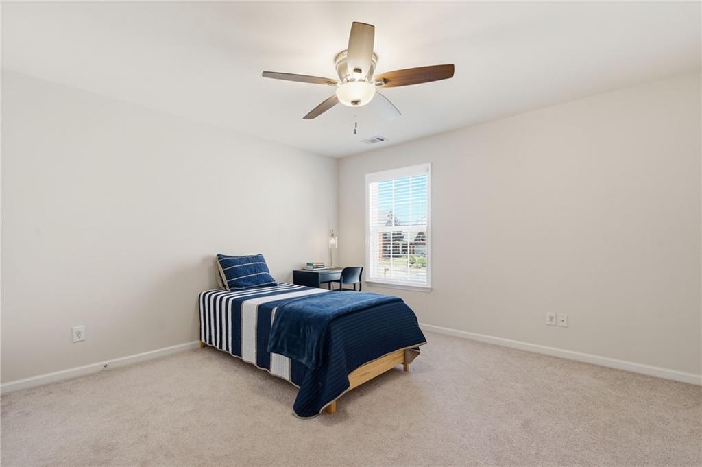 310 Hammersmith Drive Suwanee, GA 30024 - Photo 37 of 55 a room with a bed and window