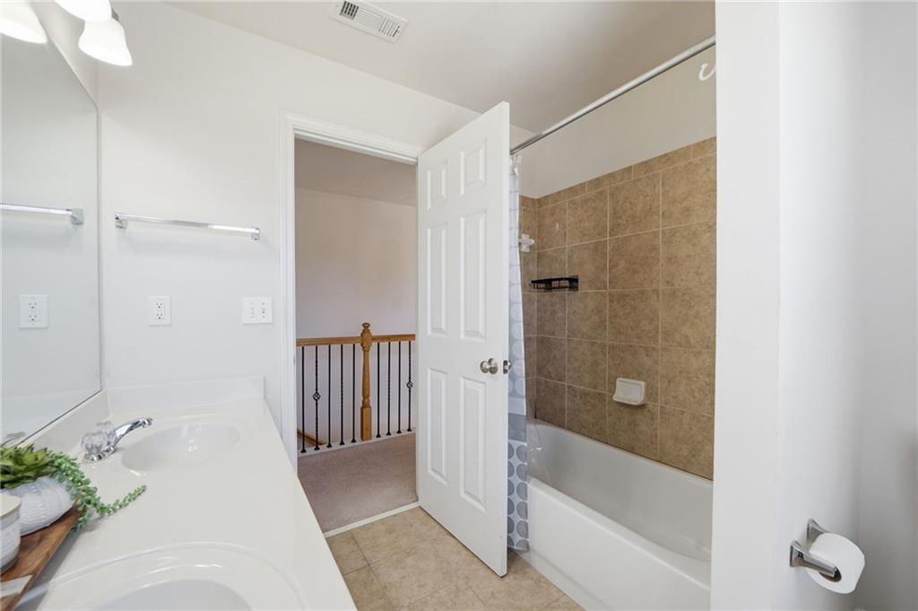 310 Hammersmith Drive Suwanee, GA 30024 - Photo 40 of 55 a bathroom with a bathtub and shower