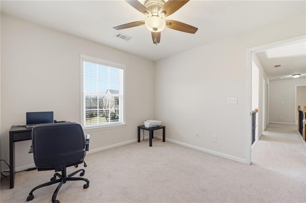 310 Hammersmith Drive Suwanee, GA 30024 - Photo 42 of 55 a view of a workspace with furniture and a window
