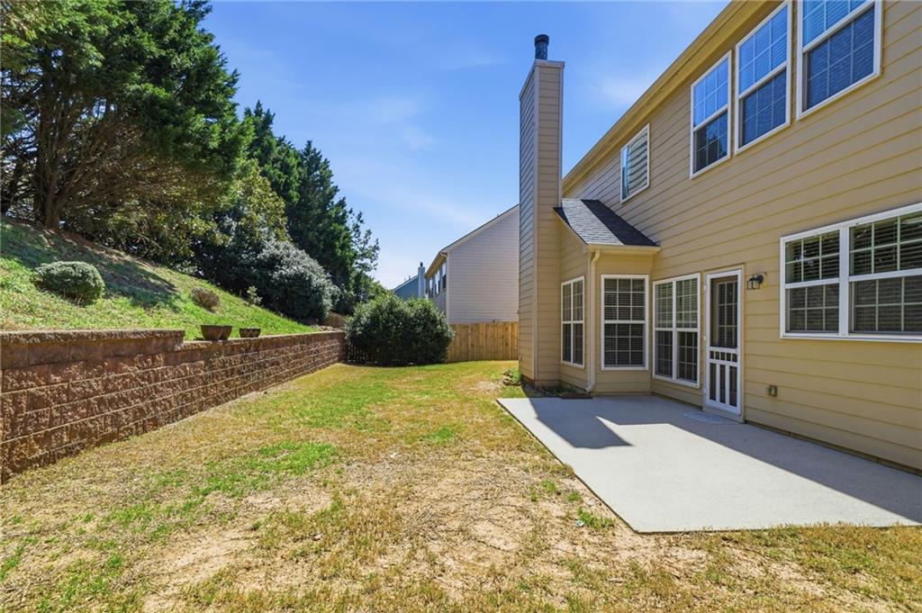 310 Hammersmith Drive Suwanee, GA 30024 - Photo 46 of 55 a view of a house with a yard