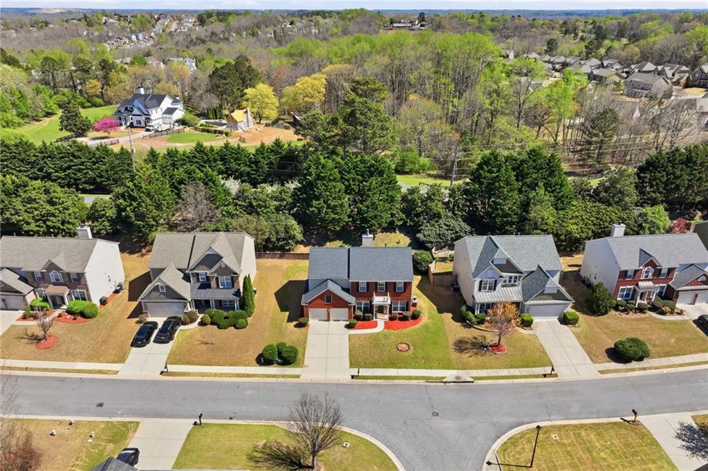310 Hammersmith Drive Suwanee, GA 30024 - Photo 50 of 55 an aerial view of residential houses with outdoor space