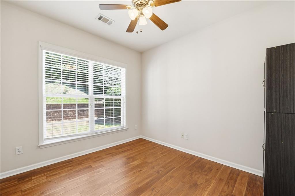 310 Hammersmith Drive Suwanee, GA 30024 - Photo 5 of 55 an empty room with a window