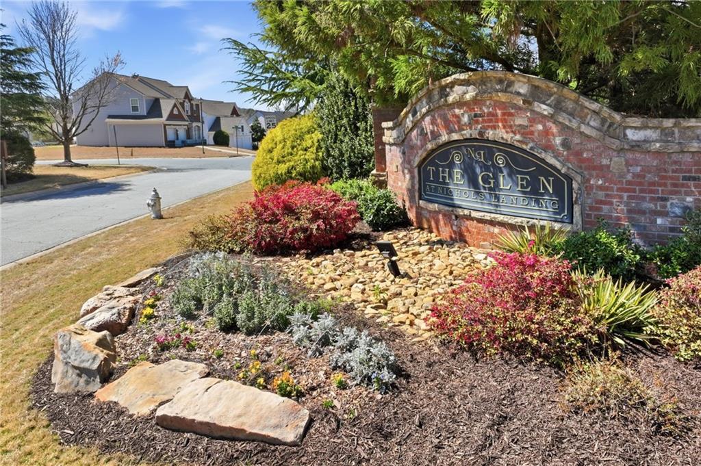 310 Hammersmith Drive Suwanee, GA 30024 - Photo 55 of 55 a front view of a house with a yard
