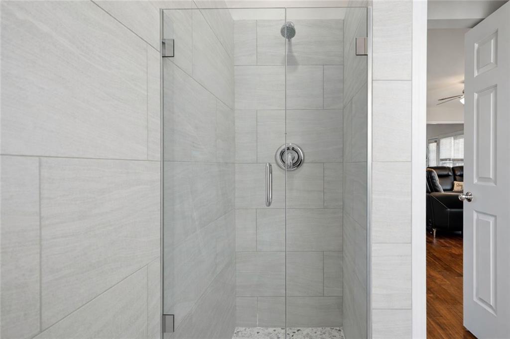 310 Hammersmith Drive Suwanee, GA 30024 - Photo 8 of 55 a bathroom with a shower