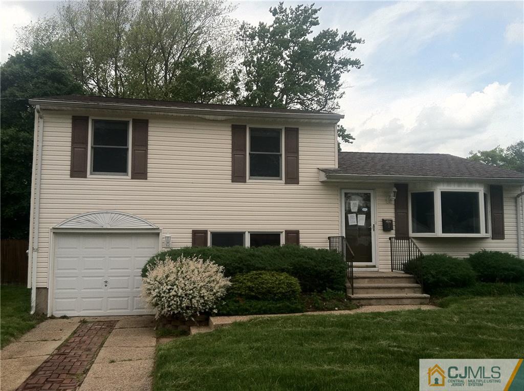 9 Eastlick Road Edison, NJ 08817 - Photo 1 of 20 a front view of a house with a garden