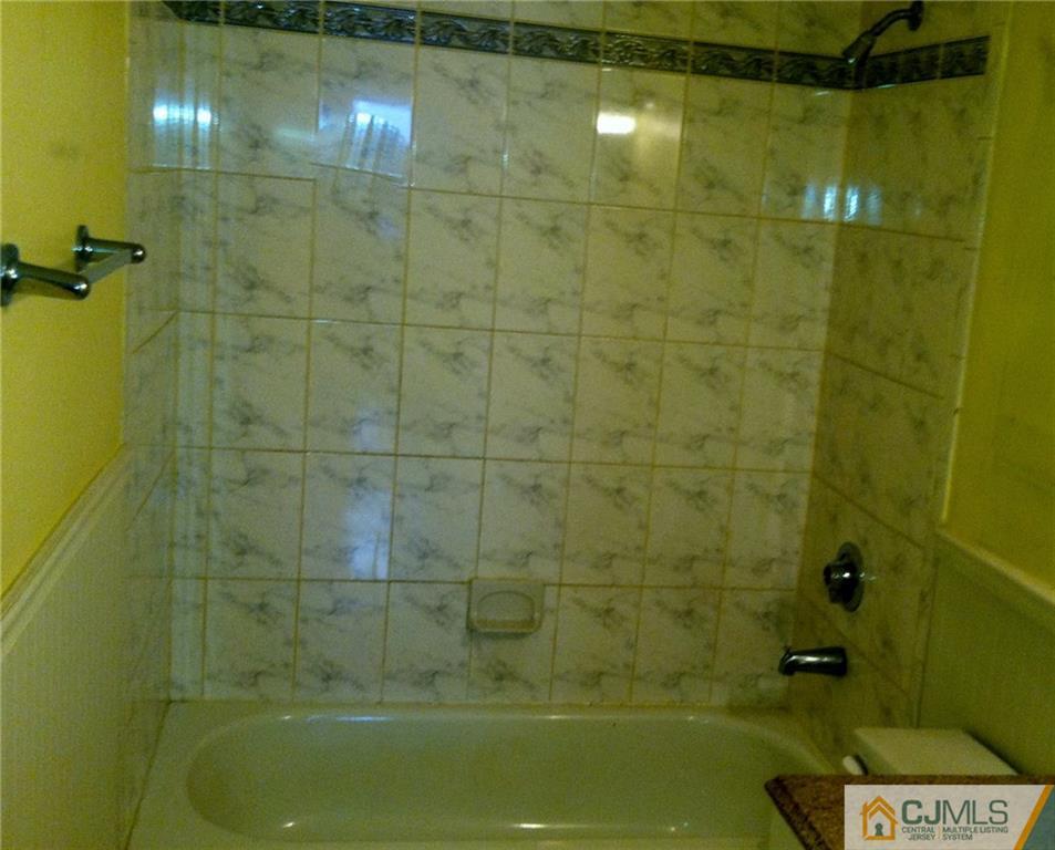 9 Eastlick Road Edison, NJ 08817 - Photo 11 of 20 a bathroom with a shower and a bathtub