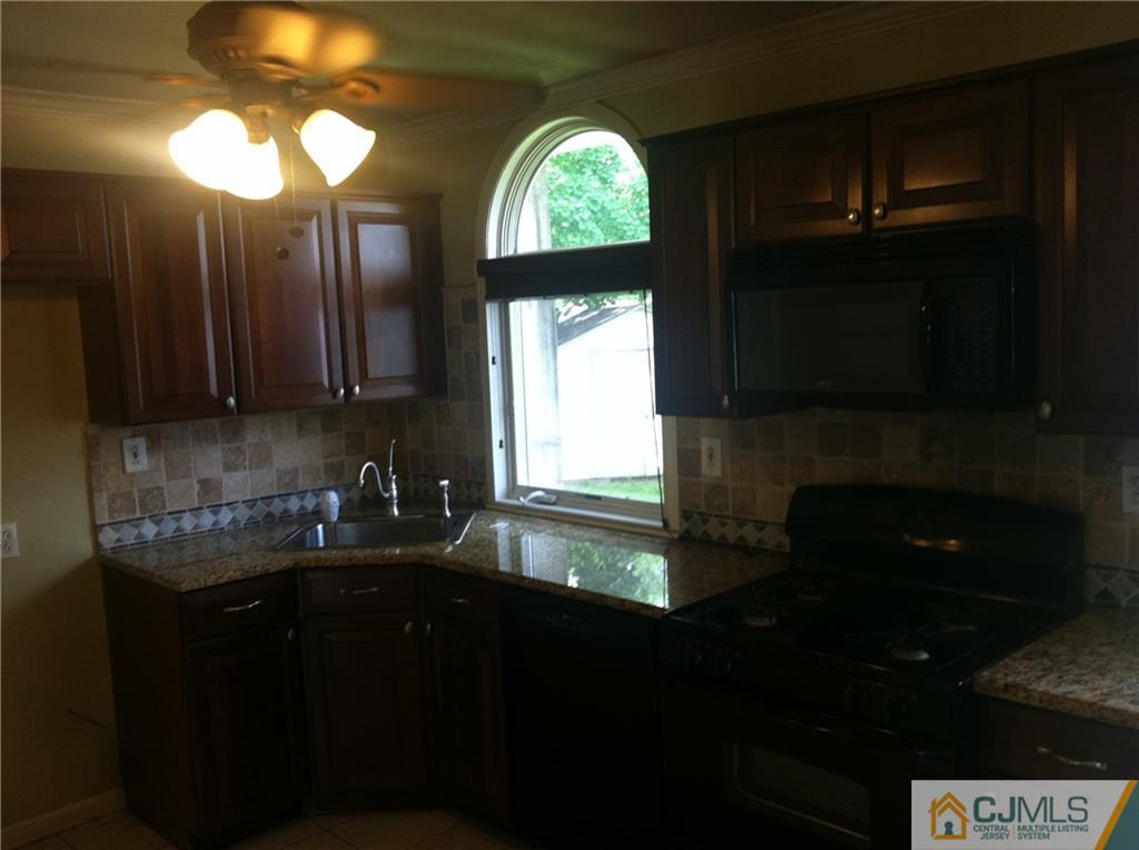 9 Eastlick Road Edison, NJ 08817 - Photo 3 of 20 a kitchen with a sink and a stove