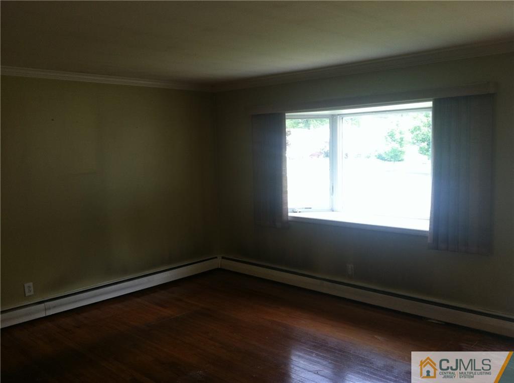 9 Eastlick Road Edison, NJ 08817 - Photo 7 of 20 a view of a room with wooden floor and a window