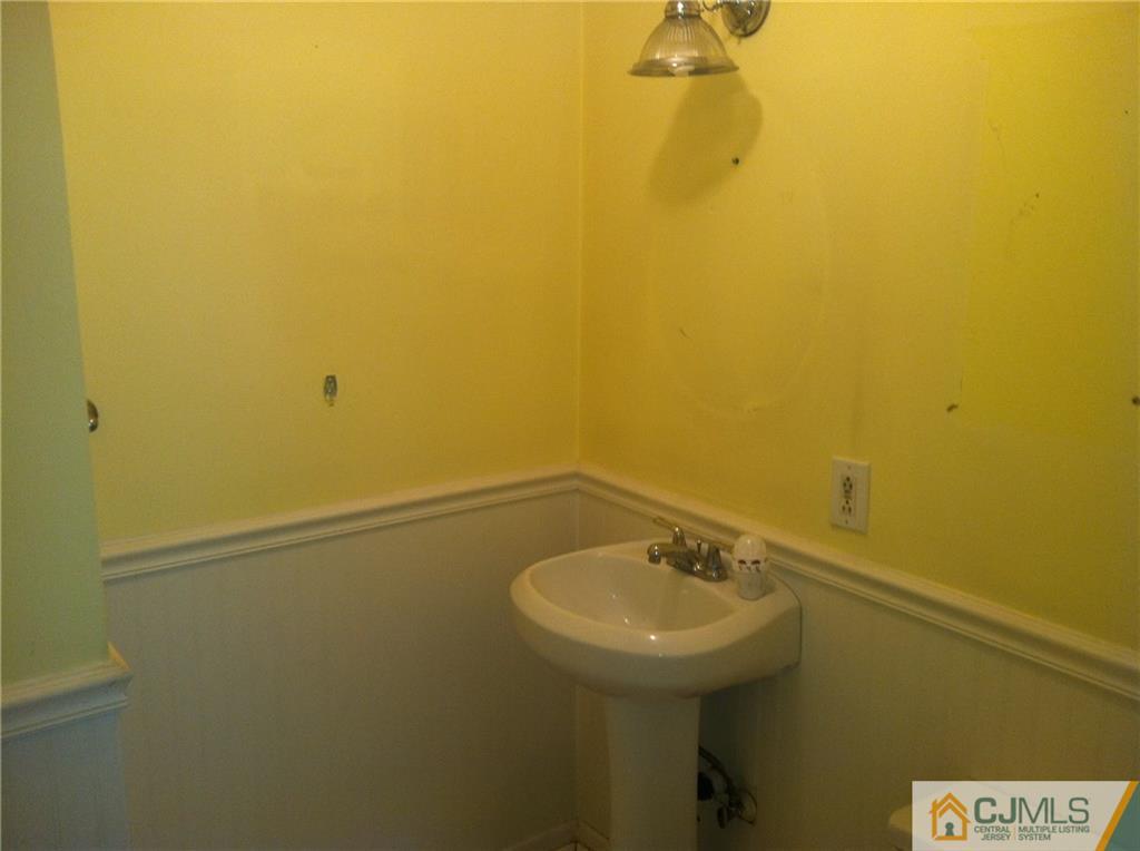 9 Eastlick Road Edison, NJ 08817 - Photo 10 of 20 a bathroom with a sink and mirror