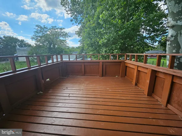 a view of deck and deck with wooden floor and fence