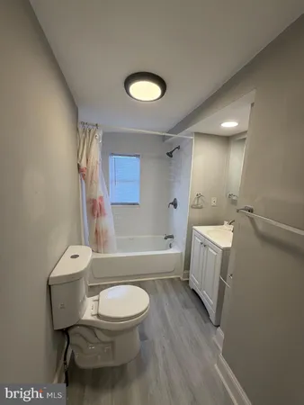 a bathroom with a toilet a sink and a bathtub