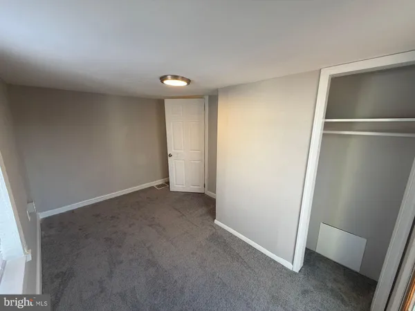 an empty room with closet