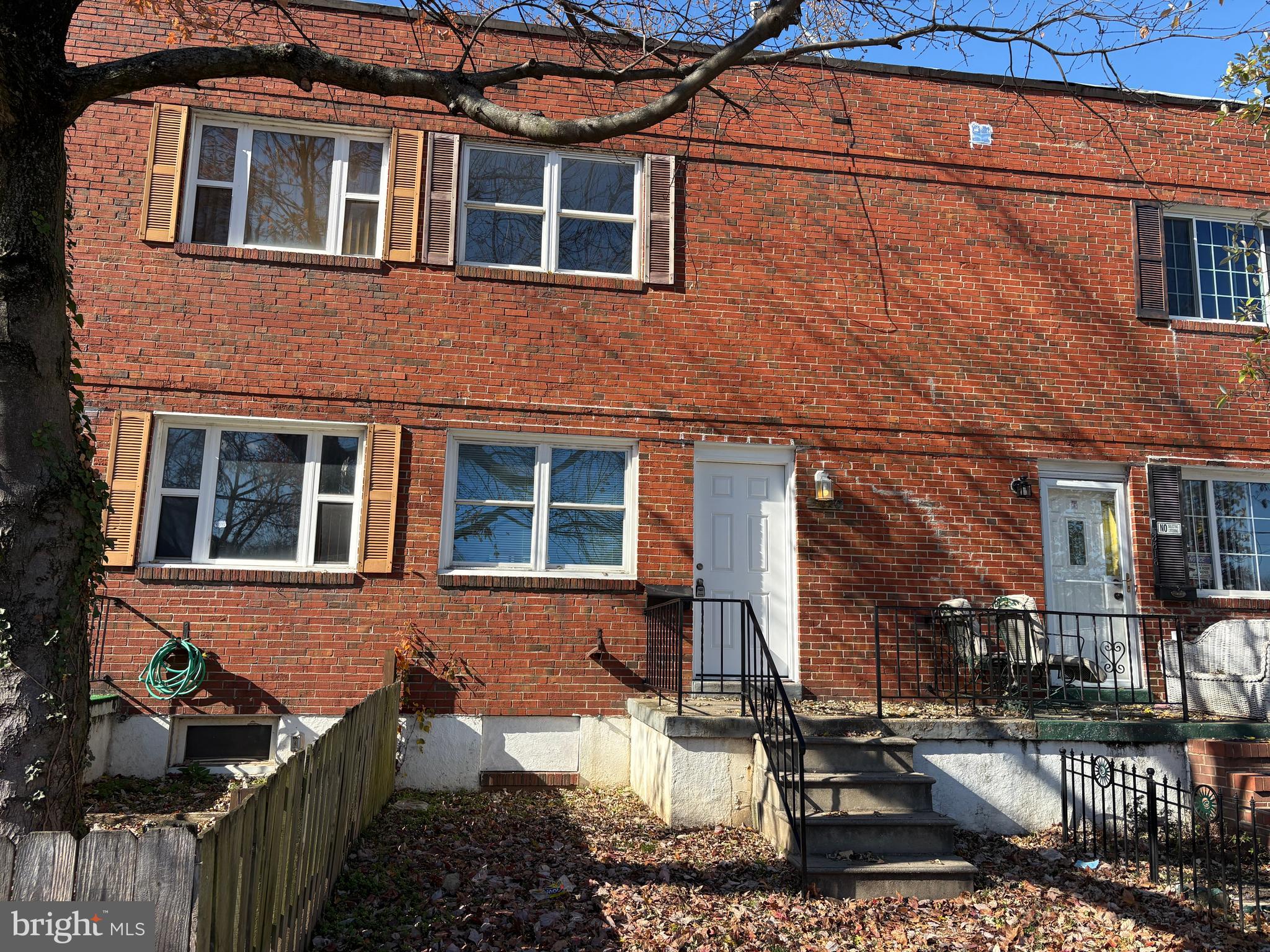 3820 2nd Street Baltimore, MD 21225 - Photo 1 of 23 a front view of a house with a yard