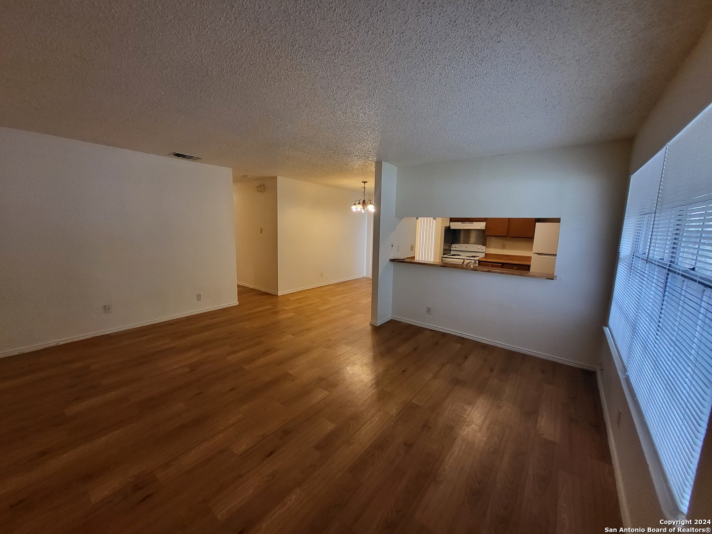 12204 Ridge Crown Street San Antonio, TX 78247 - Photo 3 of 10 a view of a room with wooden floor and a window