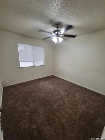 a view of a big room with carpet