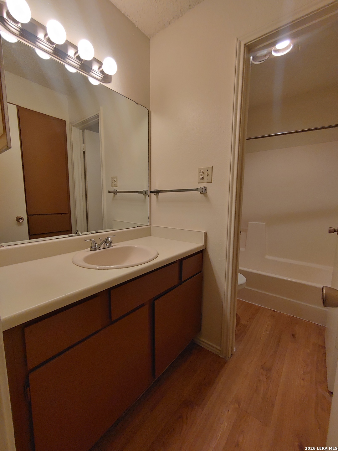 12204 Ridge Crown Street San Antonio, TX 78247 - Photo 7 of 10 a bathroom with a double vanity sink a and mirror