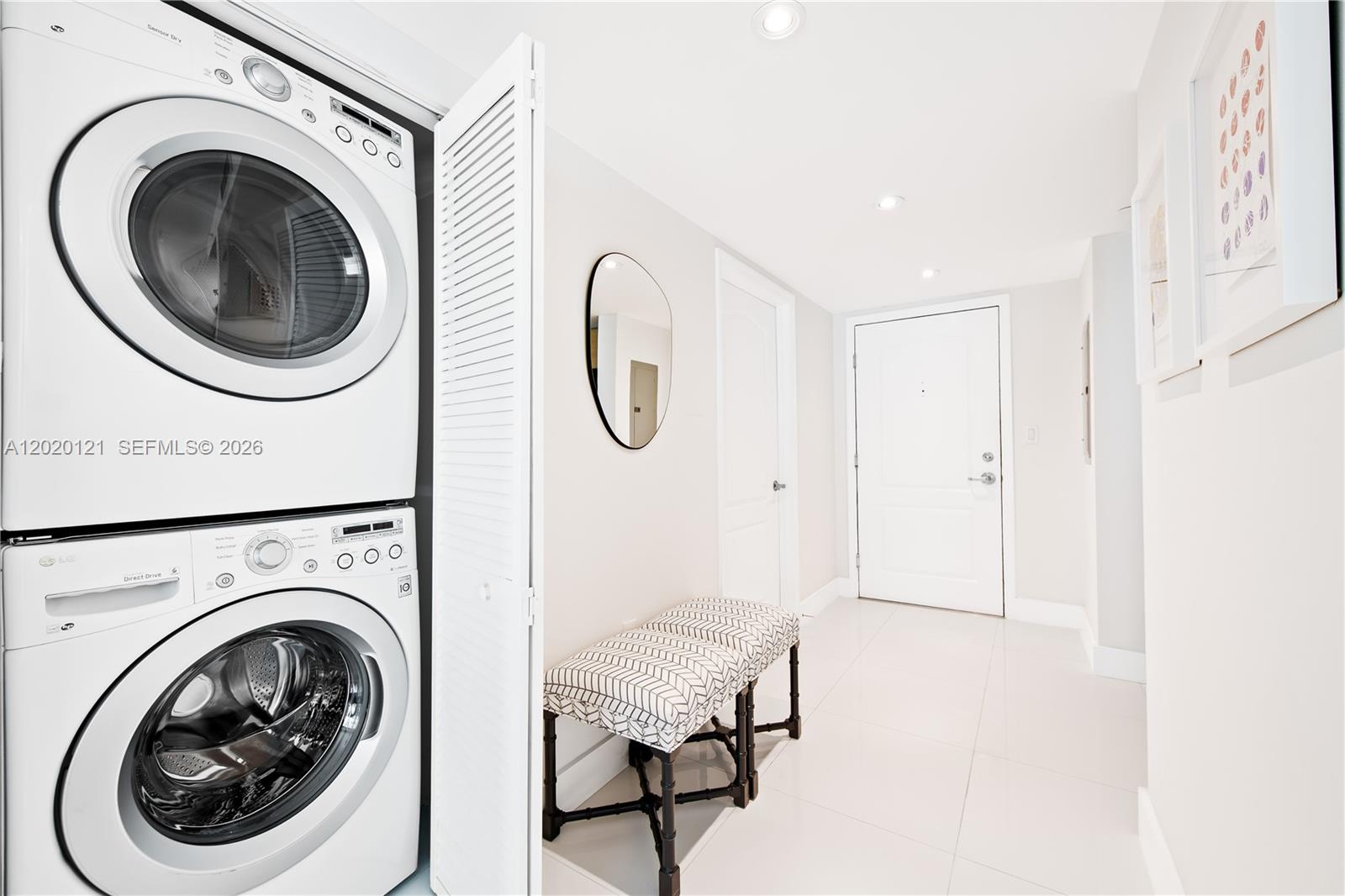2101 Brickell Avenue, Unit 1909 Miami, FL 33129 - Photo 22 of 25 a view of a hallway with washer and dryer