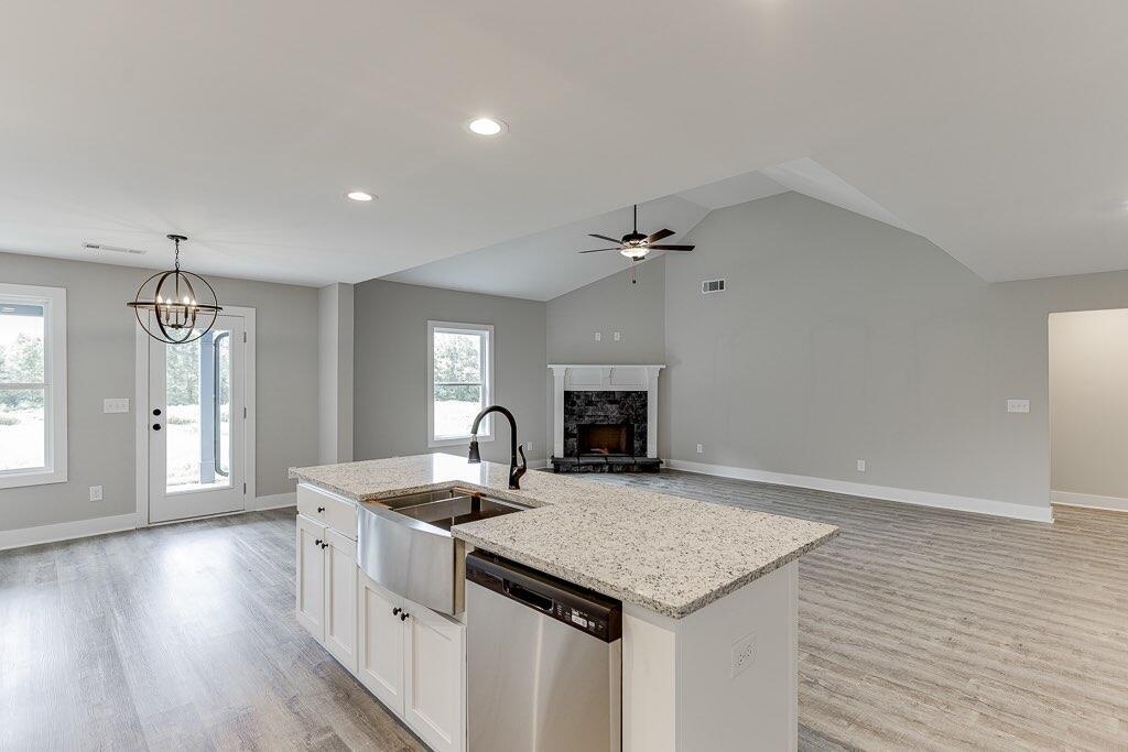 295 Anderson Thomas Road Martin, GA 30557 - Photo 12 of 44 a kitchen with a center island appliances and wooden floor