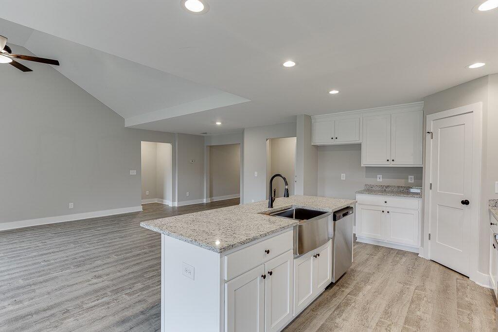 295 Anderson Thomas Road Martin, GA 30557 - Photo 13 of 44 a kitchen with stainless steel appliances granite countertop a sink stove and cabinets