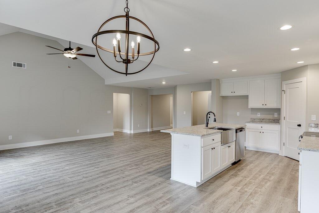 295 Anderson Thomas Road Martin, GA 30557 - Photo 16 of 44 a kitchen with stainless steel appliances a stove refrigerator and microwave