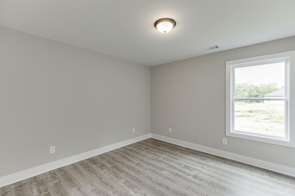 295 Anderson Thomas Road Martin, GA 30557 - Photo 21 of 44 wooden floor in an empty room with a window