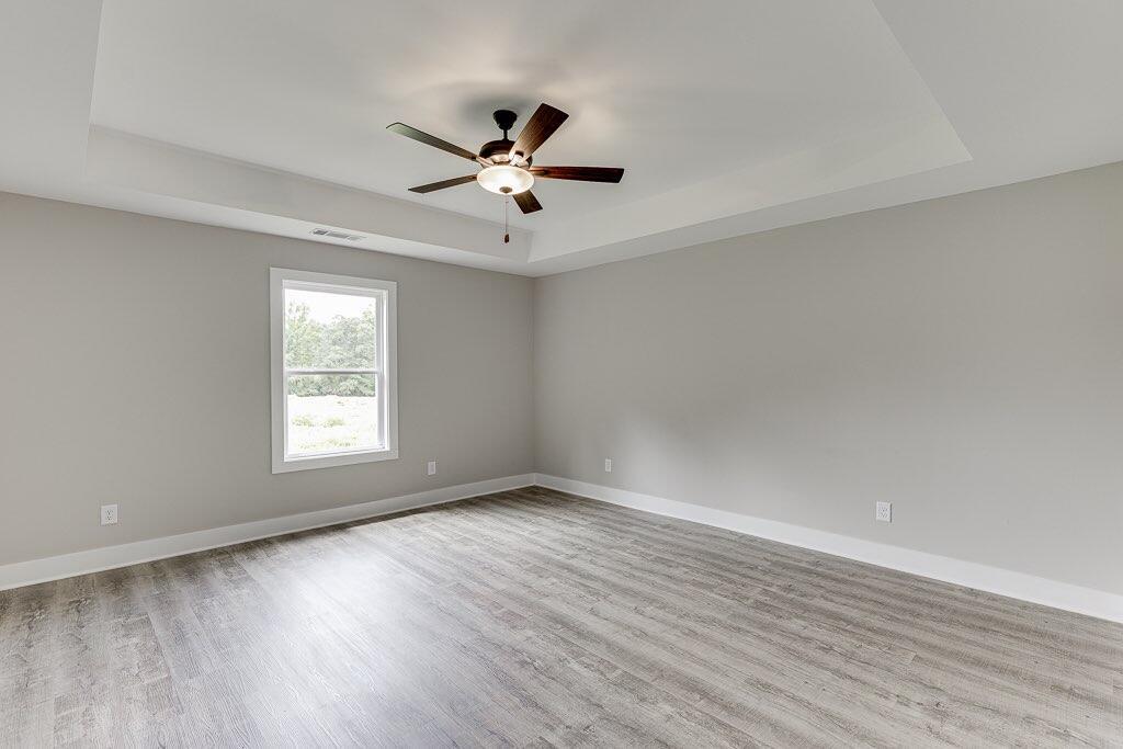 295 Anderson Thomas Road Martin, GA 30557 - Photo 23 of 44 a view of an empty room with wooden floor and a window