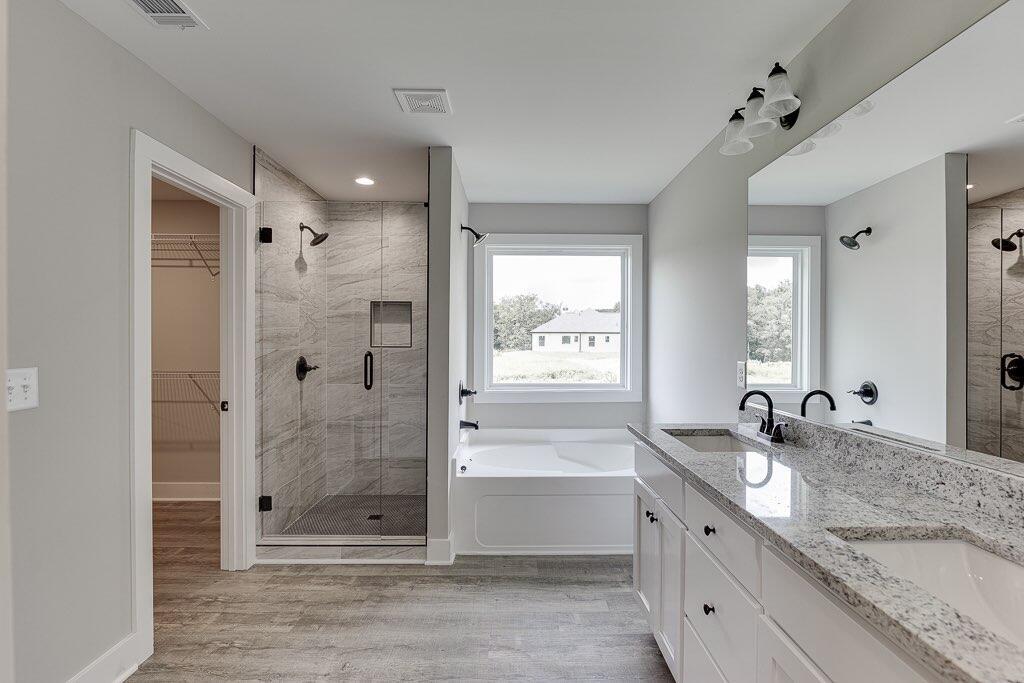 295 Anderson Thomas Road Martin, GA 30557 - Photo 26 of 44 a bathroom with a granite countertop sink mirror and shower