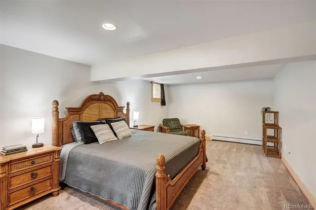 a bedroom with bed and a dresser