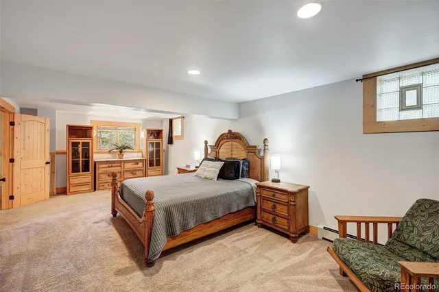 a bedroom with a bed and a dresser