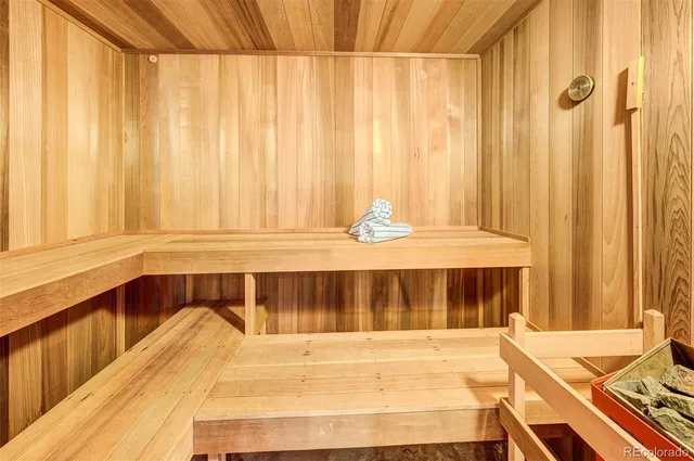 a view of a bedroom with a bed and a window